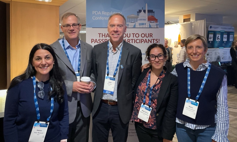 Jack Prior wearing the SAB badge with Sanofi colleagues at the PDA Regulatory Conference